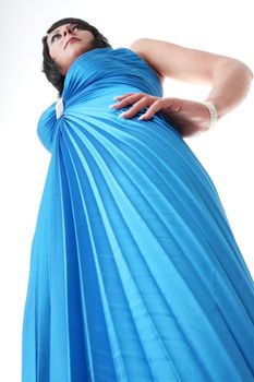Attractive young woman wearing long elegant dress.