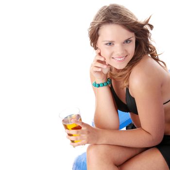 Young woman in bikini drinking ice tea isolated