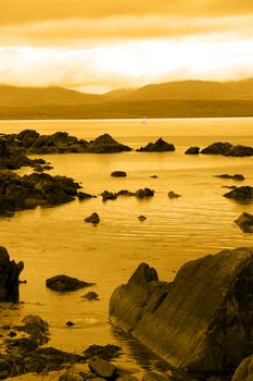 scenic view in kerry ireland of lone yacht sailing in