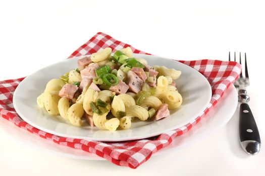 a white plate of Munich ham pasta