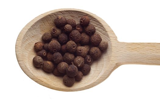 Herbs and spices on wooden spoons - Pepper