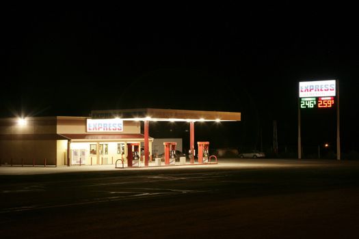 view of a no name gas station at night 