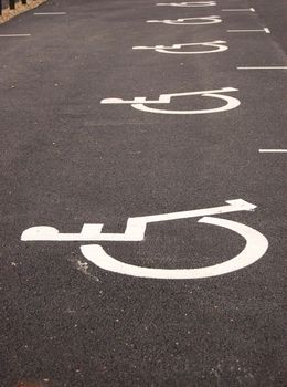 Parking place for handicapped. Sign painted on asphalt