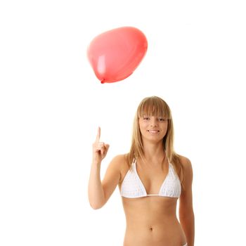 Happy young woman in bikini with heart shaped balloon - valentines concept