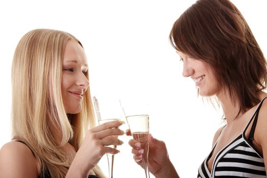 Two casual young women enjoying champagne isolated on white background