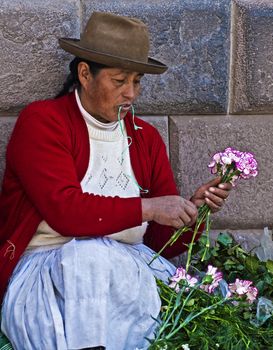 Cusco , Peru - May 27 : Peruvian woman in a market in Cusco Peru , May 27 2011