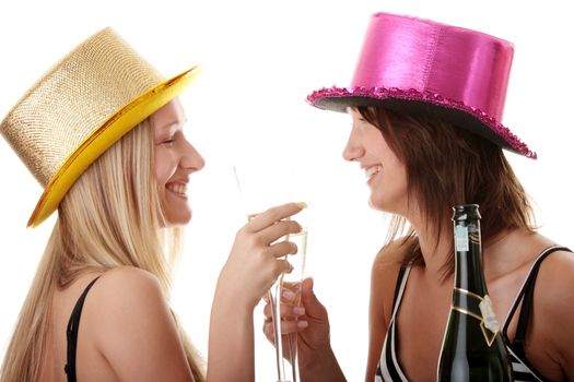 Two casual young women enjoying champagne in new yers eve