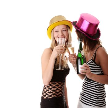 Two casual young women enjoying champagne in new yers eve