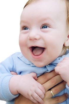Adorable blue-eyed boy happily smiling
