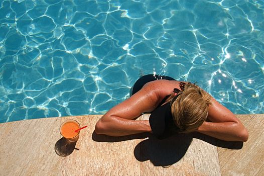 Summer vacation cocktail at a resort swimming pool on Hawaii