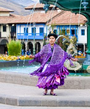 Cusco , Peru - May 25  : Peruvian dancer with traditional clothes dancing in street in Cusco Peru on May 25 2011