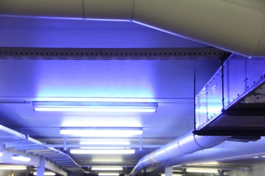colorful neon lights on the ceiling of a parking slot