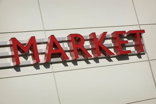 word "MARKET" as a sign in red letters