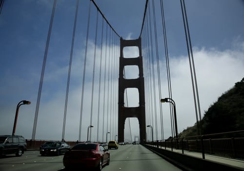 view of the golden gate bridge while driving on it