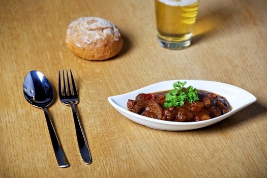 hungarian goulash and a glass of beer