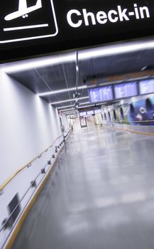 airport terminal corridor with check in banner