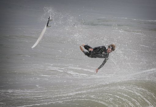 surfer in california flying over a wave