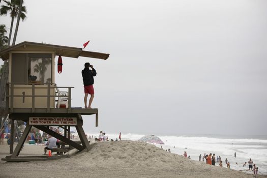 lifeguard observing a beach scene in california