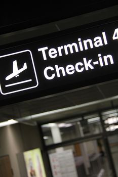 airport terminal corridor with check in banner