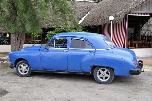 Vintage car shows signs of aging near Havana, Cuba.