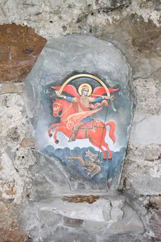 icon of Saint George painted on stone 