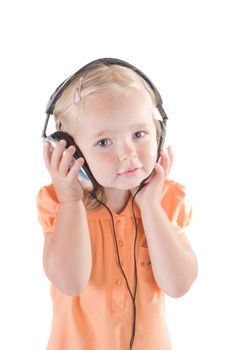 Shot of little girl with headphones in studio