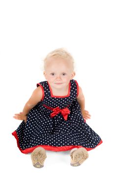 Shot of little girl in polka dot dress in studio