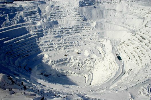 View of snow covered mining steps in open pit