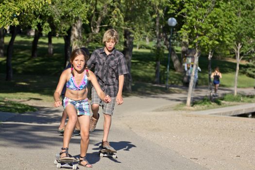 Kids riding on their skateboard on a beautiful afternoon in the park