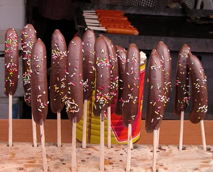 Banana covered in chocolate-street festival food          