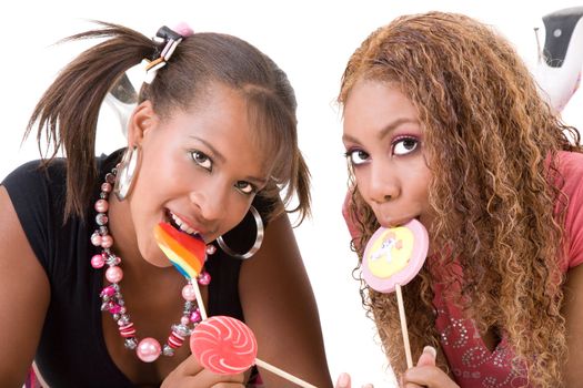 Two cute black girls eating a a lollipop