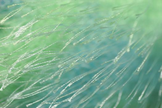 Extreme closeup of textured carpet fibers material in an abstract pattern