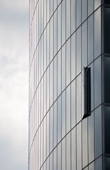 Modern skyscraper with one window opened