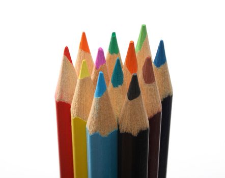 Set of colored wooden pencils upright over white