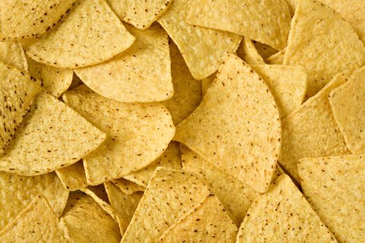 Yellow triangular chips close up in all shot
