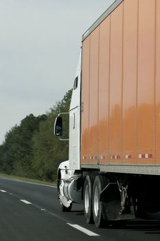 Delivery or shipping truck on the road to interstate travel with cargo.