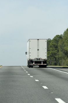 Cargo truck on the highway delivering products and goods.