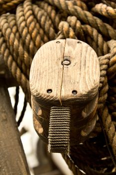 An old rope and wooden block pulleys of an old pirate ship