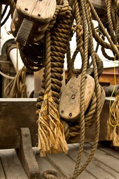 An old rope and wooden block pulleys of an old pirate ship