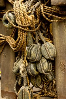 An old rope and wooden block pulleys of an old pirate ship