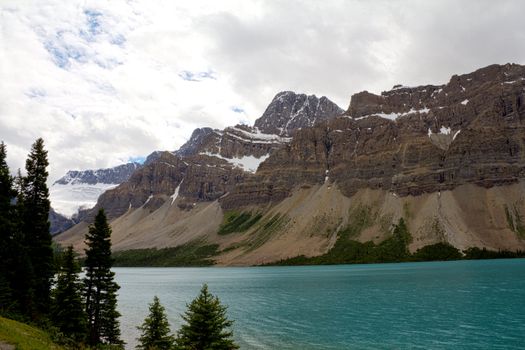 The beautiful turquoise colored Mourane Lake against the backdrop of the majestic mountains of the Canadian Rockies