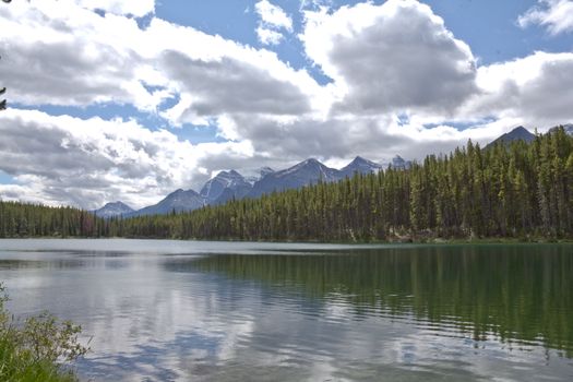 The beautiful turquoise colored Mourane Lake against the backdrop of the majestic mountains of the Canadian Rockies