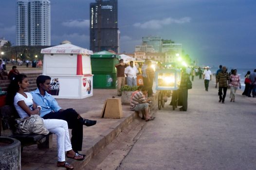Colombo,Sri Lanka - February 22,2011: Quay in Colombo in the evening, with strolling  along the coast couples