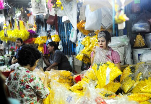 Bangkok, Thailand -  March 15, 2011: Seller at local market in Bangkok Chinatown.Bangkok�s Chinatown is a popular tourist attraction and a food haven.