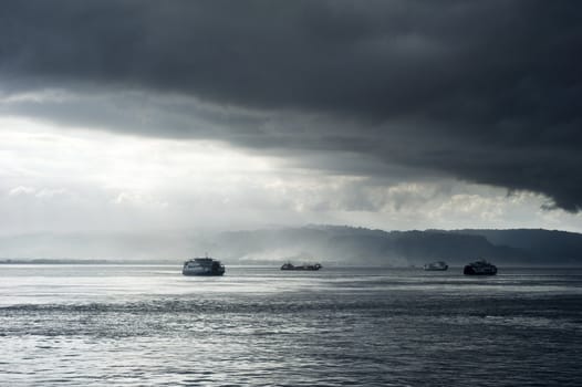 Ferry from Java to Bali under the storm. Indonesia