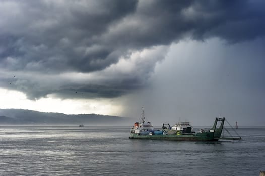 Ferry from Java to Bali under the storm. Indonesia