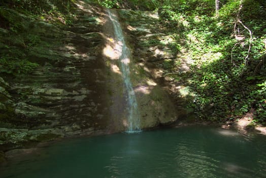 photo of the beautiful waterfall in tropical forest