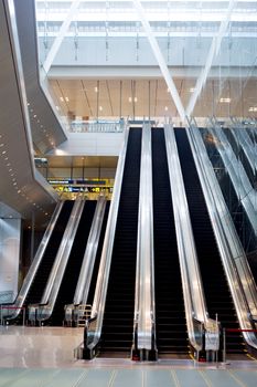 Escalator at Changi Airport . Changi International Airport, or simply Changi Airport, is the main airport in Singapore. A major aviation hub in Southeast Asia, it is about 17.2 kilometres (10.7 mi) north-east from the commercial centre in Changi, on a 13 square kilometres (5.0 sq mi) site