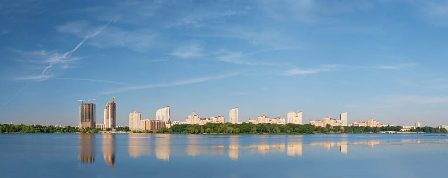 Panorama of Kyiv modern district Obolon with beautiful clouds