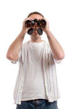 A young man wearing casual clothing is holding a set of binoculars to his eyes, isolated against a white background